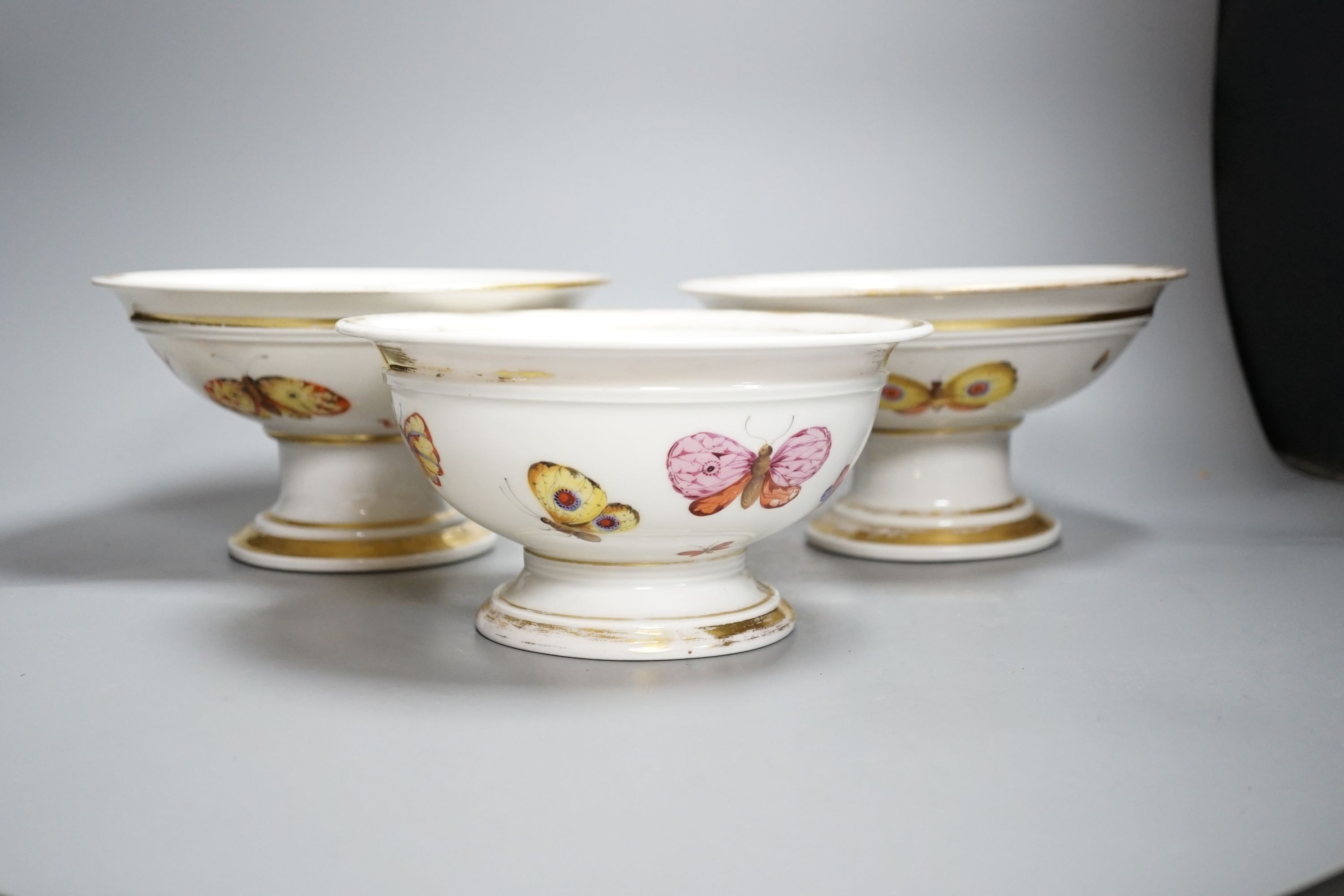 A pair of mid 19th century Paris porcelain ‘butterfly’ comports and similar example (3)